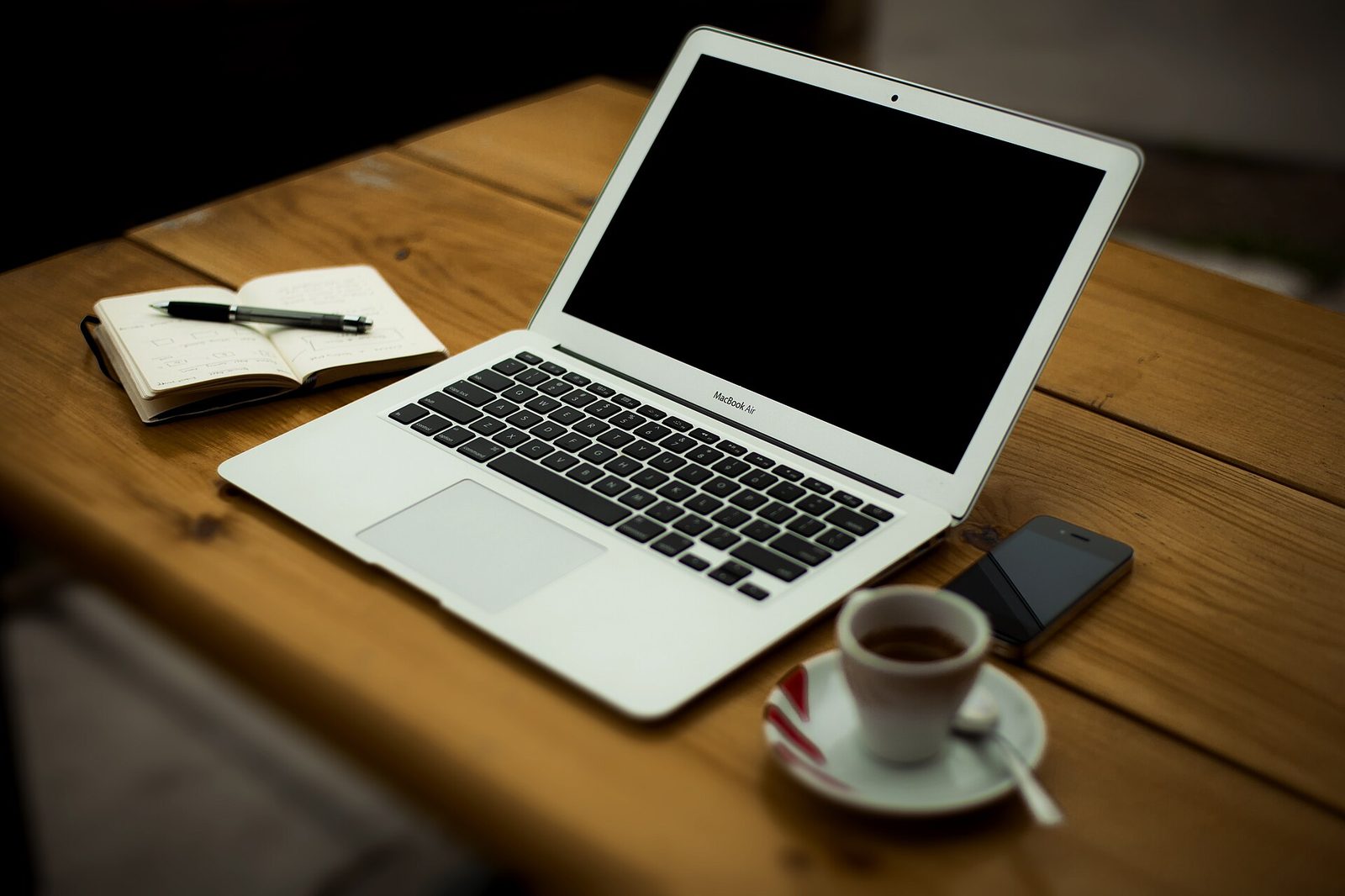 A quiet home-office desk setup where planning conversations can take place by video call